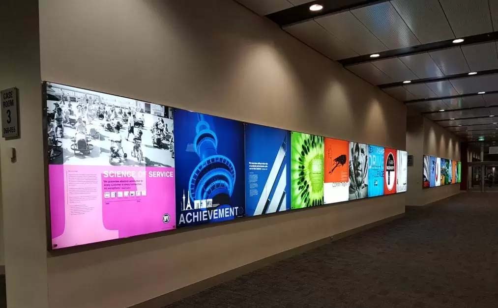 Illuminated wall display featuring multiple colourful light boxes, demonstrating bright and even backlighting using LED module lights. Illuminated wall display featuring multiple colourful light boxes, demonstrating bright and even backlighting using LED module lights.